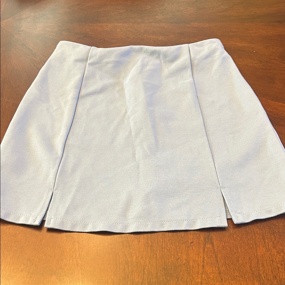 Bradely Michelle Elegant Light Blue Women's Mini Skirt
Size S